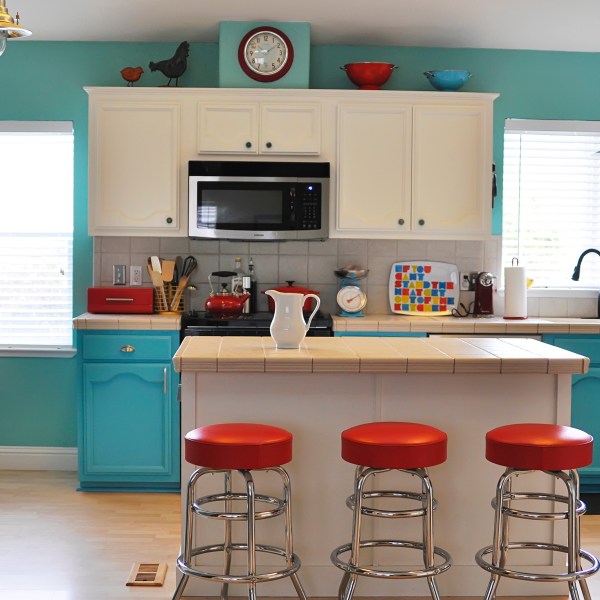 Colorfully painted kitchen with white cabinets